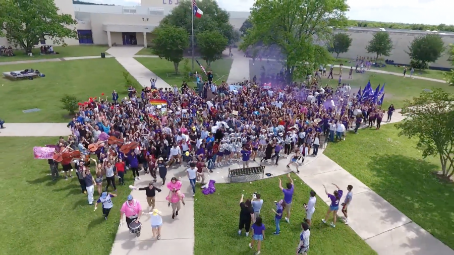 Photo taken from the previous LASA lip dub in 2017. Students gather around the Texas statue as the final shot of the video. courtesy of Advanced AVP