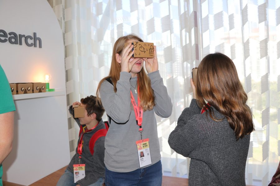 Sophomore Charles Taylor and freshmen Emma McBride and Catie Graves (left to right), Liberator staff writers, try on Google VR that depicted environmental causes. photo by adviser Kevin Garcia