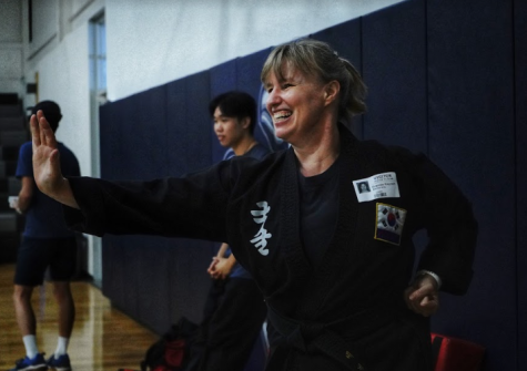 WATCH AND LEARN A representative from the Kuk Sool Won of Oak Hill Martial Arts demonstrates basic martial
arts to students. The demonstrations were held in the large gym every Monday and Thursday from Oct. 17-27
and were organized by members of the Chinese Club. photos by Kayla Le