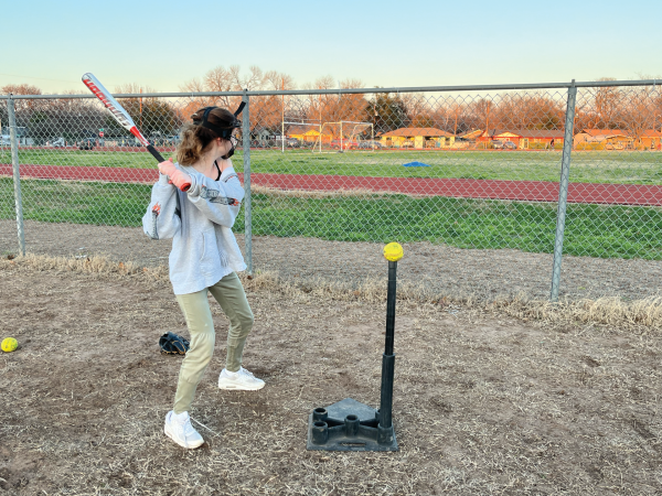 BATTER UP | Esmé Kessler prepares to swing at a softball. This was part of a drill to get accustomed to swinging the bat.
