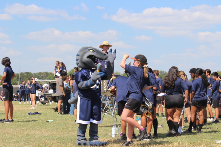 RALLY DAY WONDERS Raptor mascot Blue gets students excited during the homecoming pep rally. The mascot helps encourage the student body to participate and showcase their school spirit,