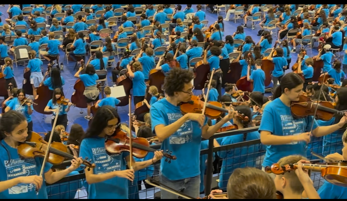 RAPTORS PLAY AWAY LASA orchestra plays at Stringfest. Students guided and played alongside younger students. Courtesy of Horvitz.