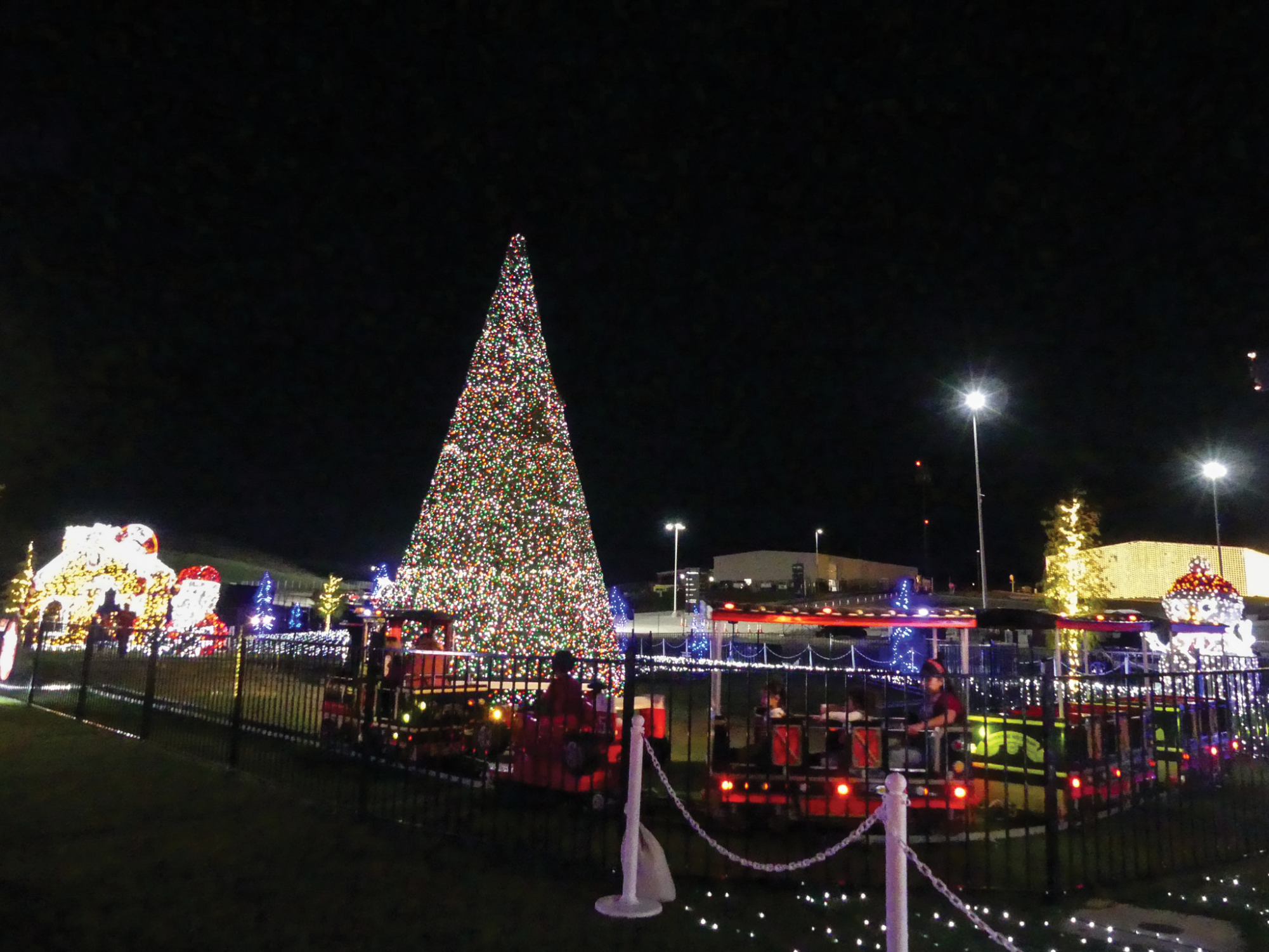 PEPPERMINT PARKWAY TRAIN RIDE Lights spread
around the Circuit of The Americas. Guests ride on a train
going around a lit up Christmas tree. 